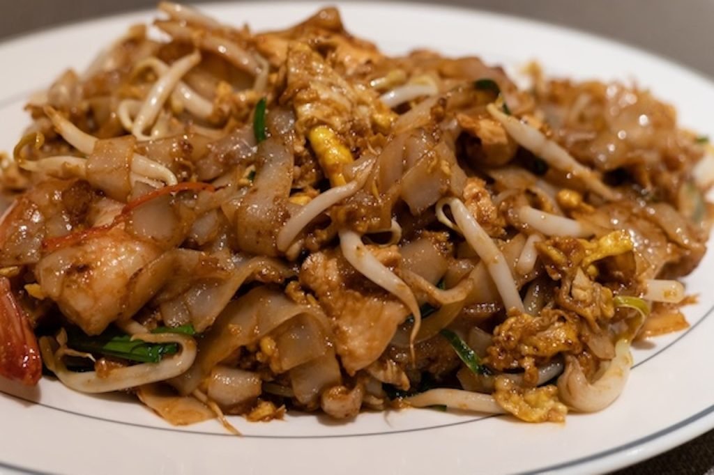 Top 10 Must-Try Street Foods in Kuala Lumpur - A plate of Char Kway Teow.