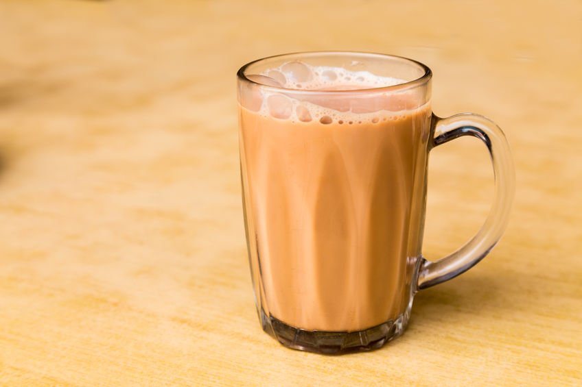 Top 10 Must-Try Street Foods in Kuala Lumpur  - A glass of Teh Tarik. Frothy Milk Tea